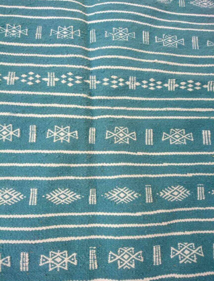 Hand-woven blue and white kilim rug in natural wool