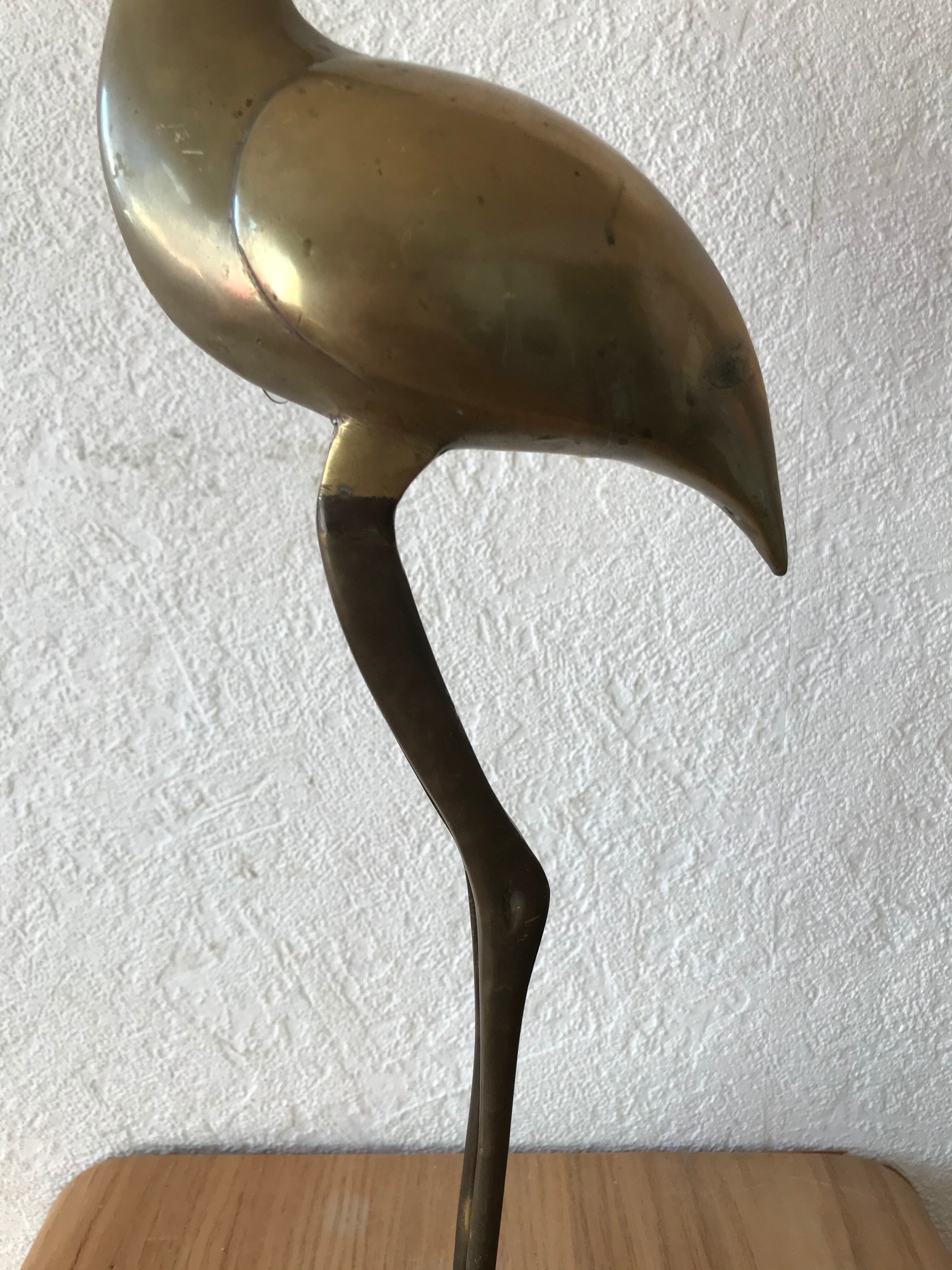 Brass wading bird