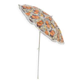 Vintage parasol in brown orange flower canvas with fringes on the edge