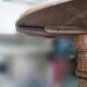 Three-legged side table in solid fruitwood.