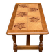 Solid wood and ceramic coffee table from the 1970s.