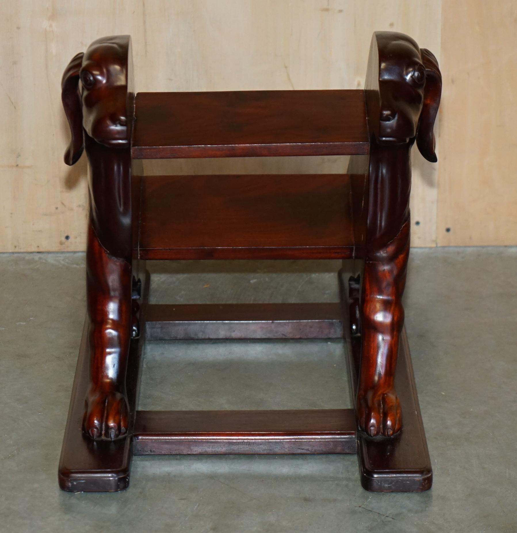 Pair of hardwood library steps with carved dogs, Regency style.