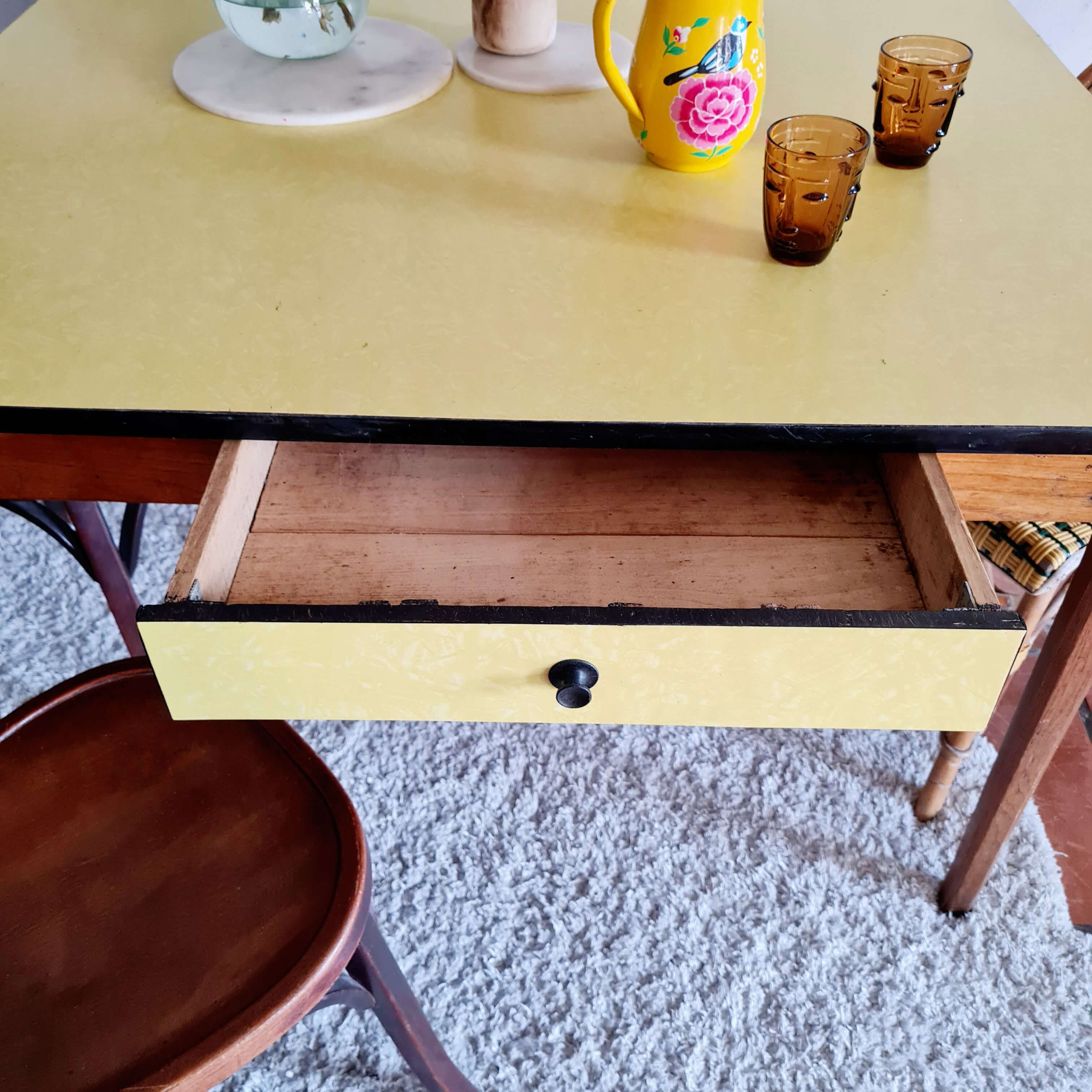 Old wooden farmhouse table and yellow formica top