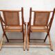 Pair of folding chairs in bamboo and caning, leather and brass
