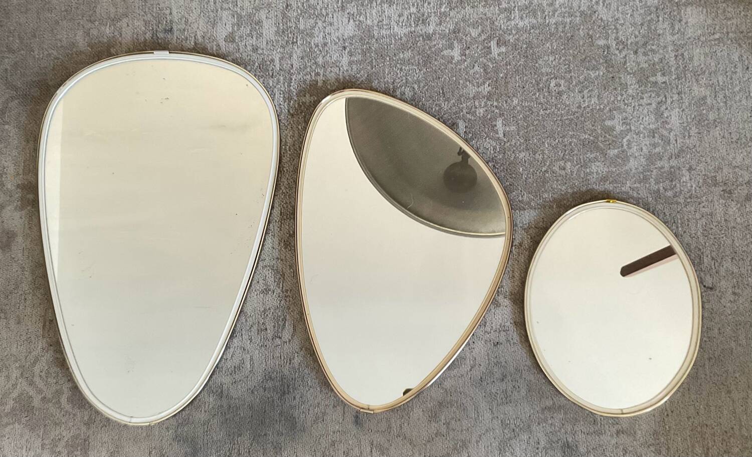 Trio of asymmetrical free-form mirrors from the 60s and 70s