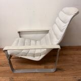 Pulkka armchair by Ilmaria Lappalainen and its ottoman