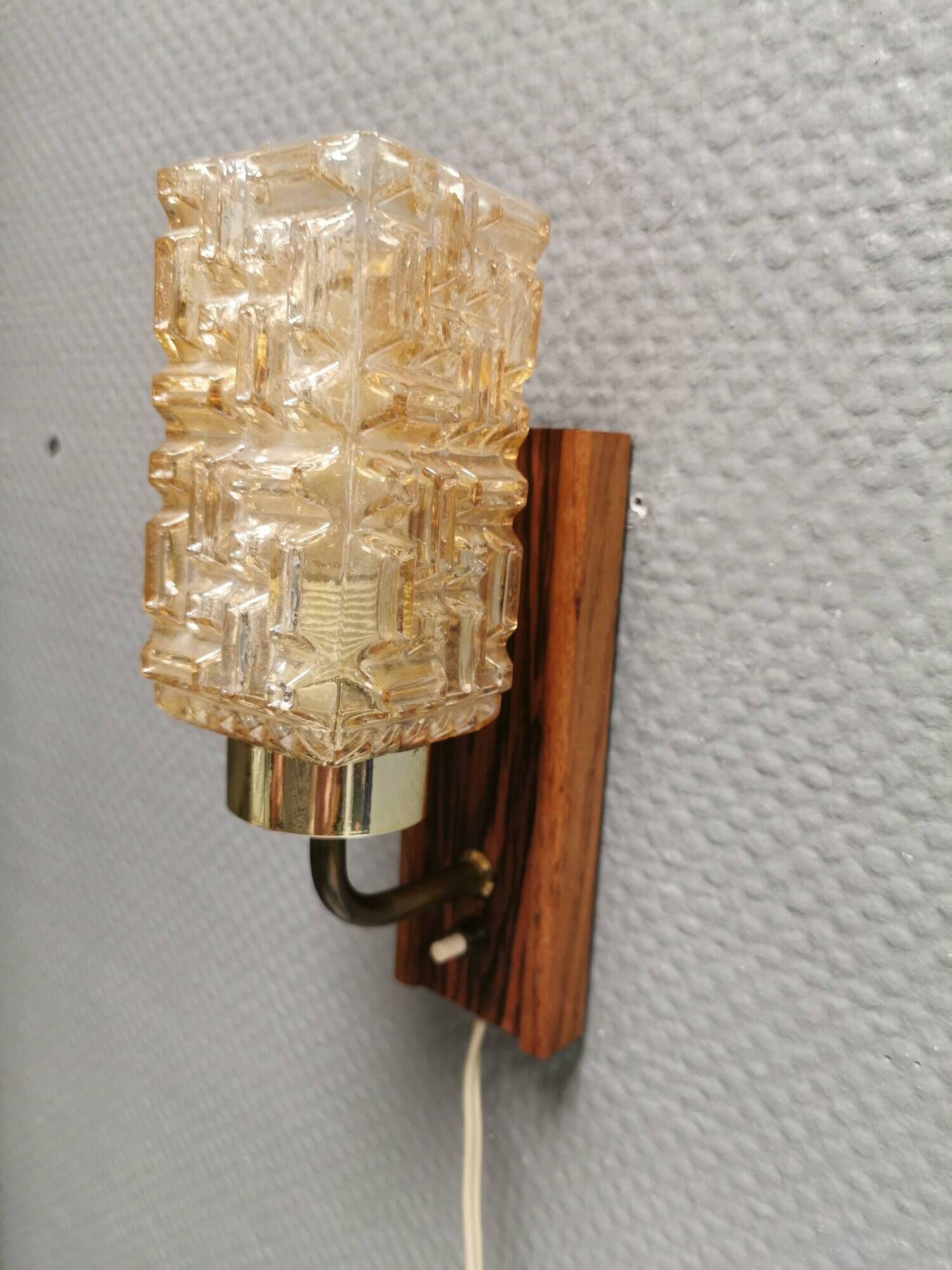 Small, stylish wall lamp with rosewood suspension and hard pressed glass