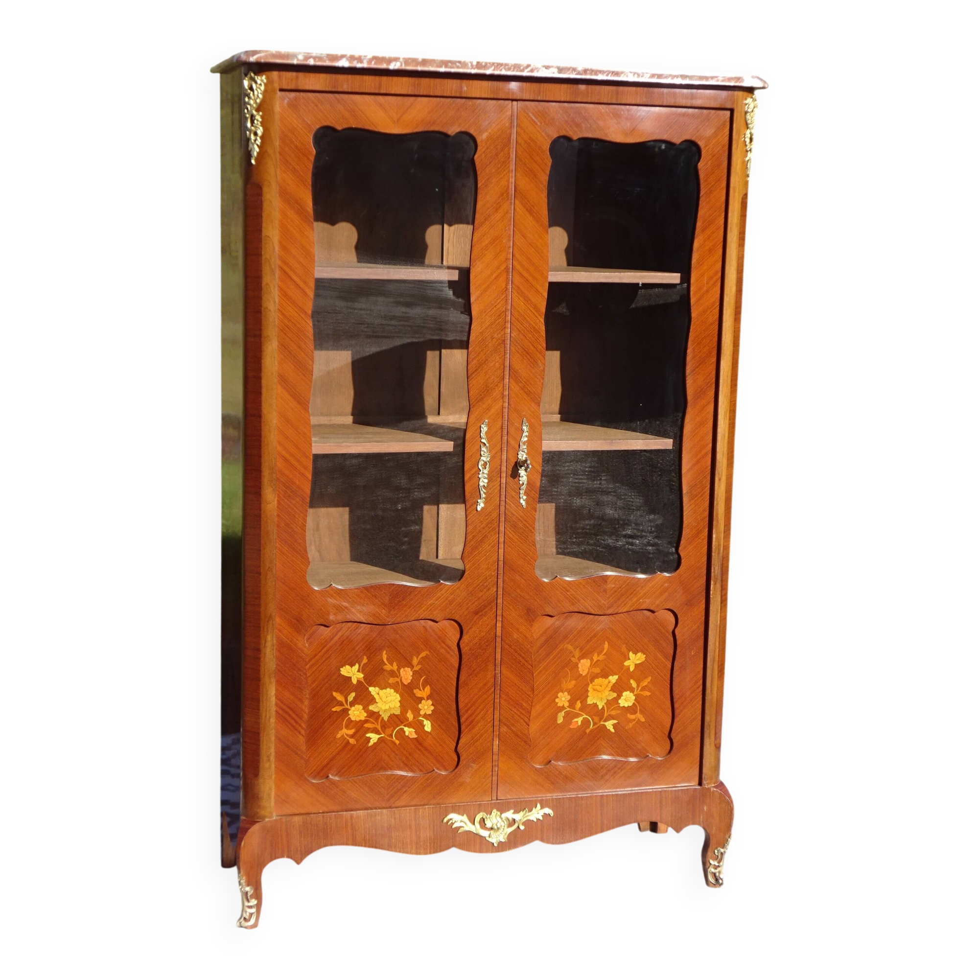 Glass library with rosewood marquetry in the Louis XV style.