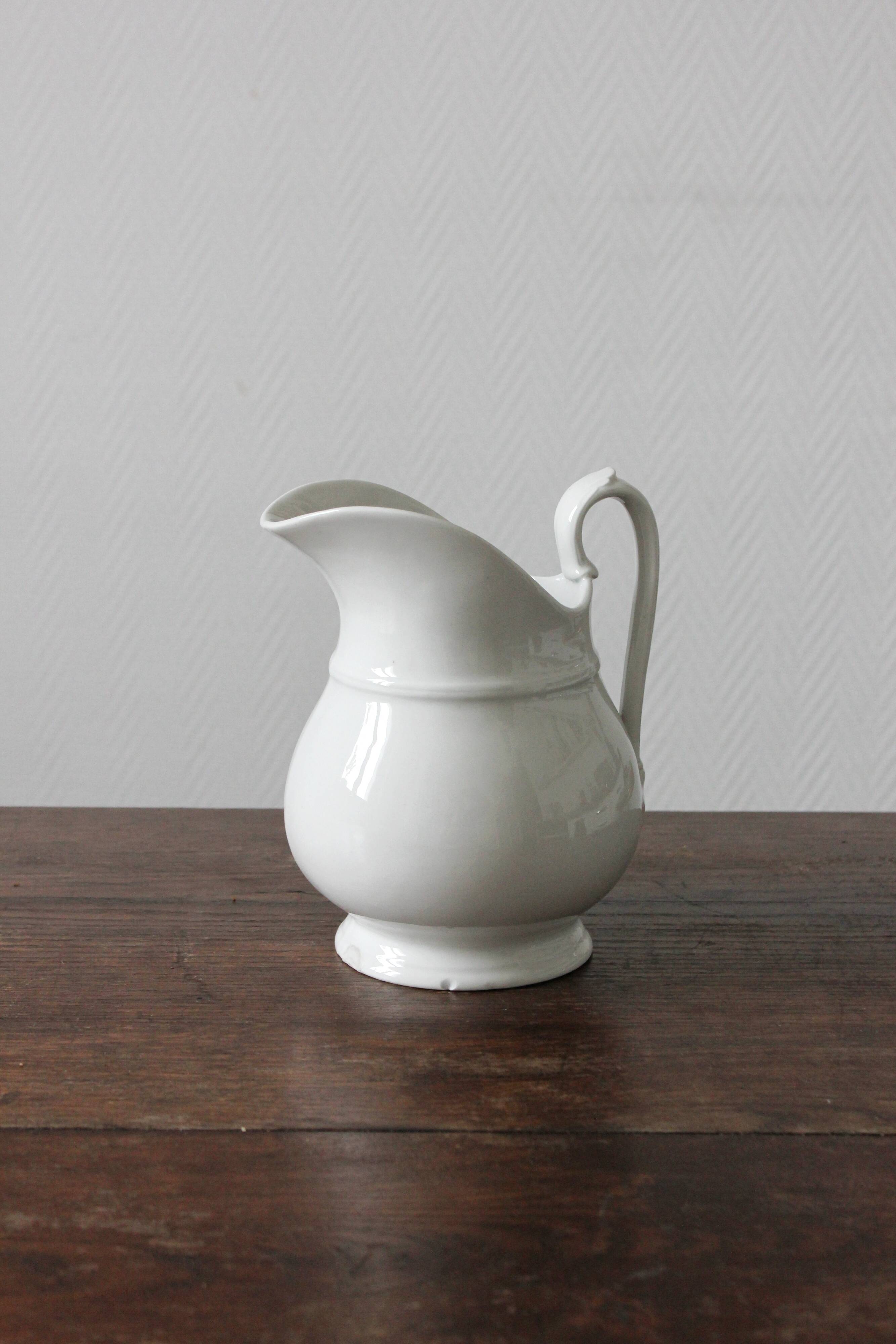 Old broc in white earthenware