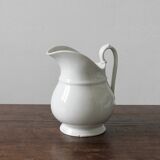Old broc in white earthenware