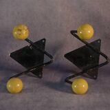 Pair of vintage black wrought iron and yellow wood coat hooks 1950