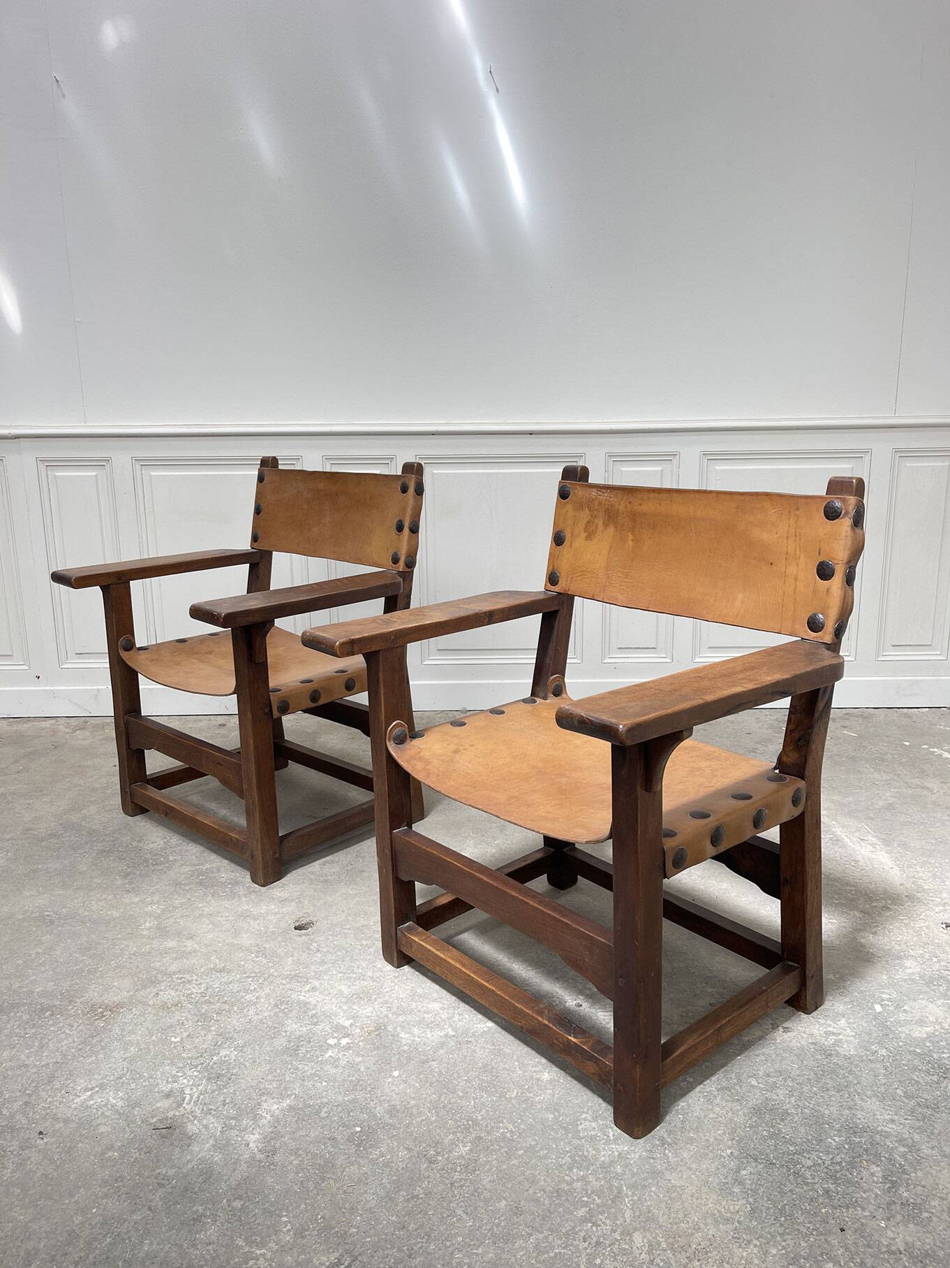 Pair of leather and walnut armchairs from the 1950s