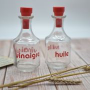 Oil and vinegar with red writing