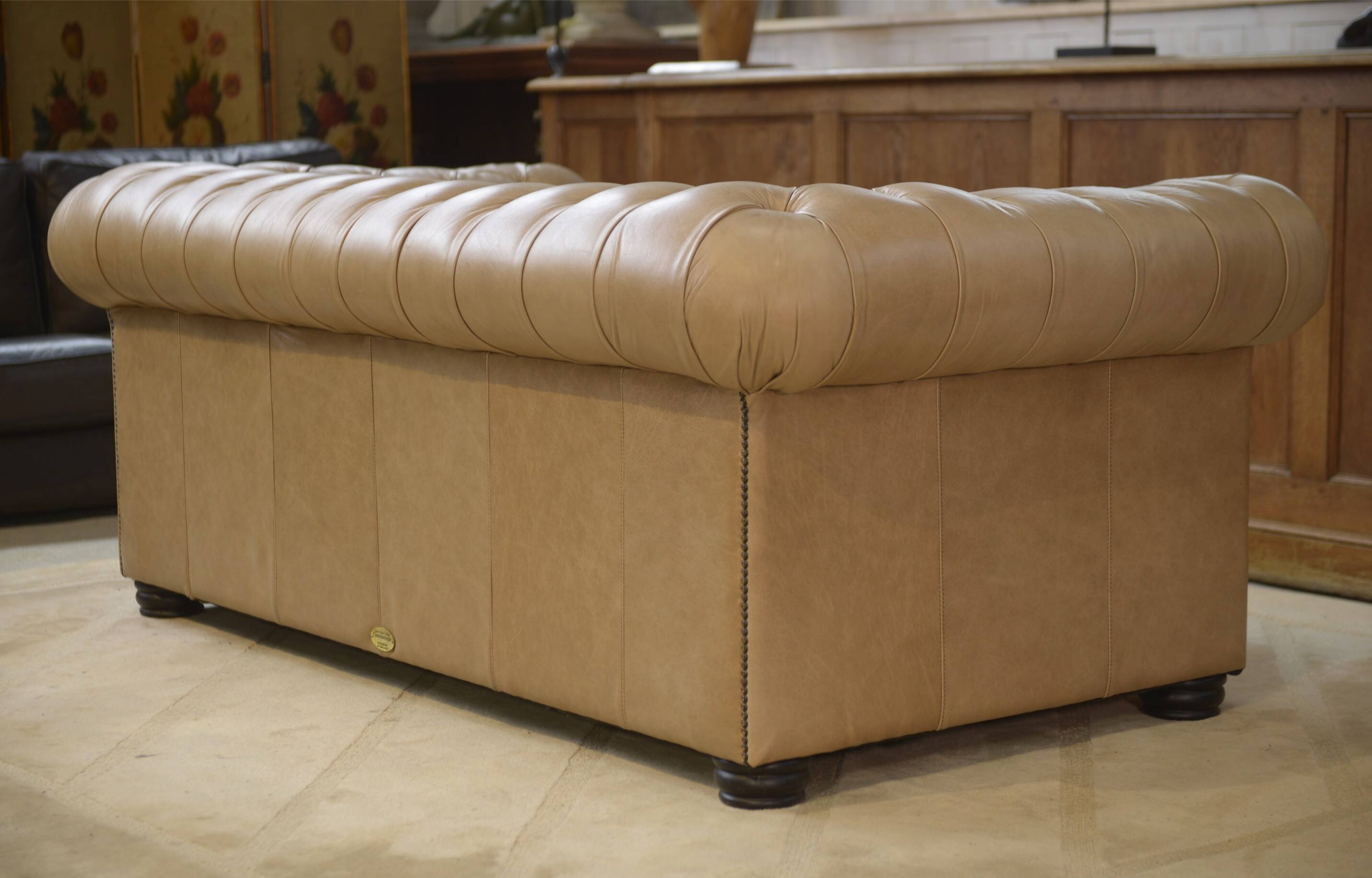 Beige leather Chesterfield sofa handmade in England.