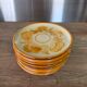 8 vintage dessert plates with a signed decoration.