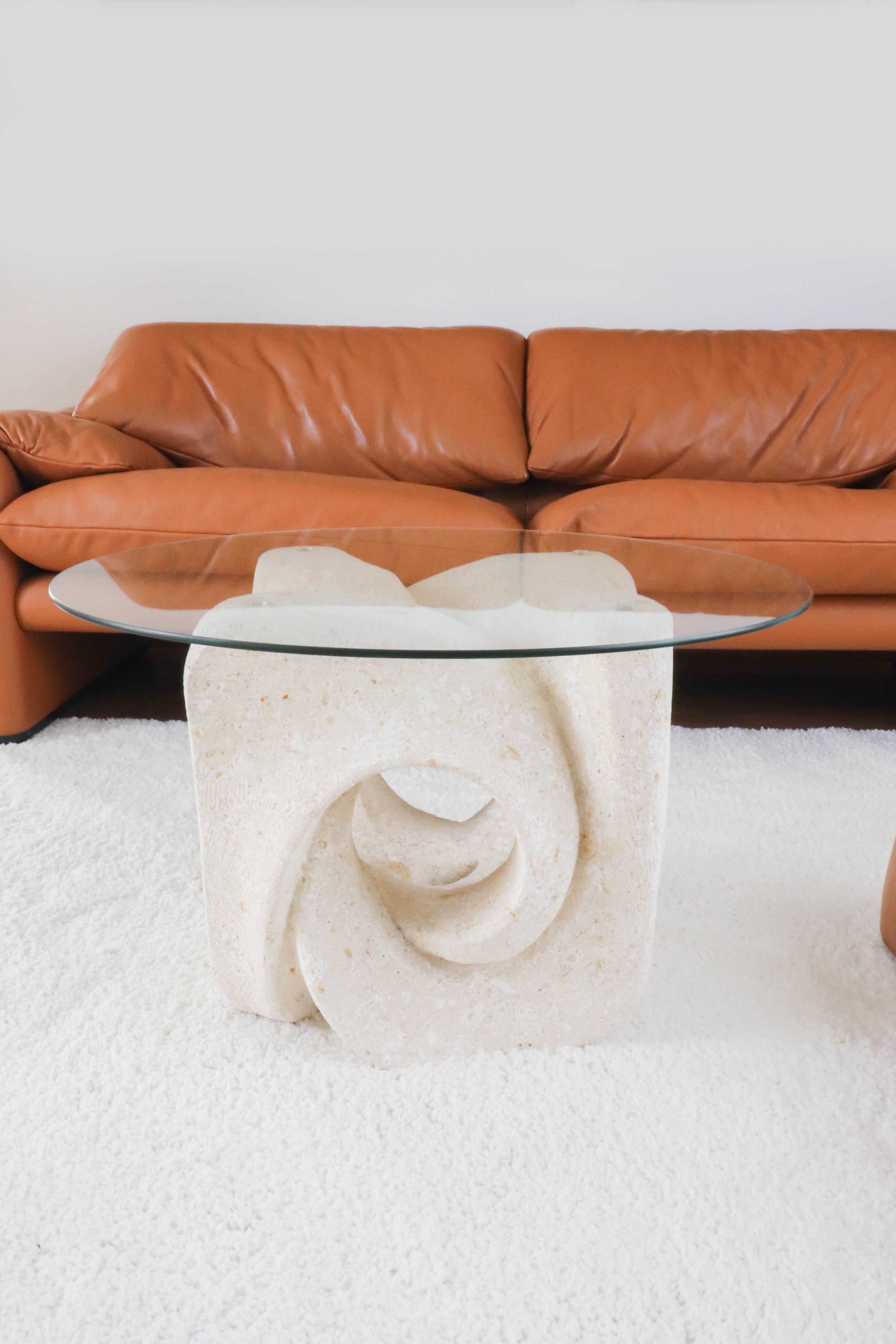 A Vintage White Stone Coffee Table with Glass Table Top