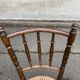 Vintage 19th-century bistro chair made of curved solid wood and caned in the Thonet style.