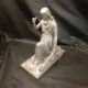 Statuette of a woman in gilded cast iron (Joan of Arc?)