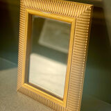 Mirror with striated and gilded decor