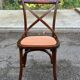 4 bistro chairs with curved wooden backs and cross braces / Crossback