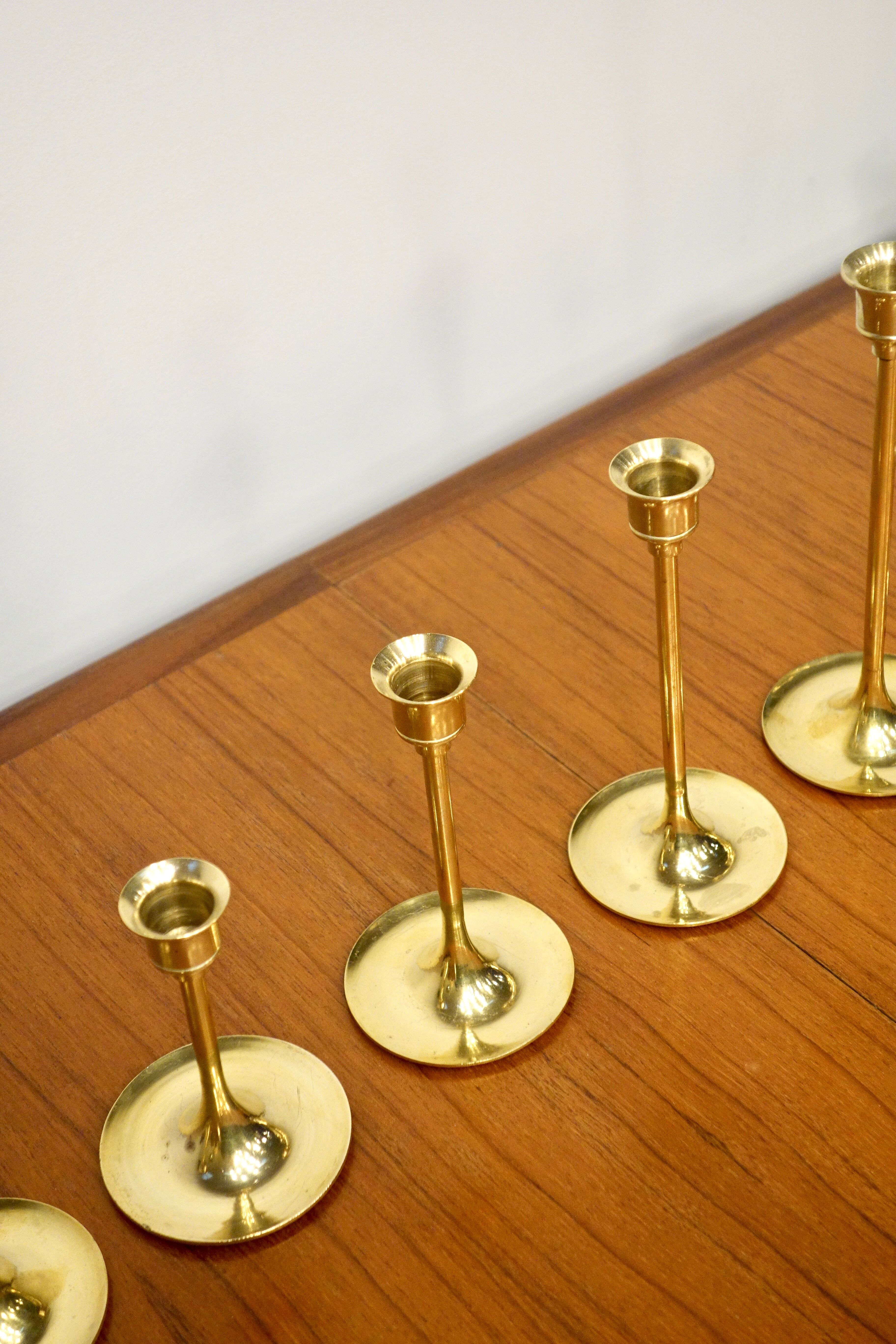 Set of 7 Scandinavian brass candle holders, 1960's