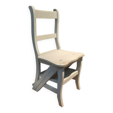 White chair convertible into a staircase.