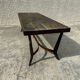 Coffee table with stone top and iron legs