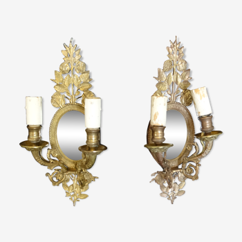 Pair of gold metal sconces with two arms of light with glass