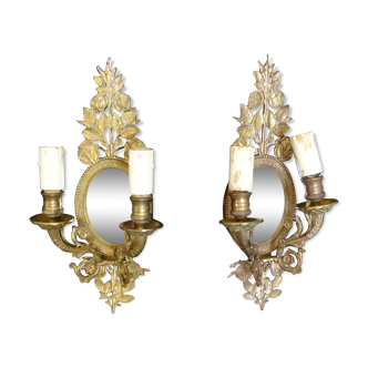 Pair of gold metal sconces with two arms of light with glass