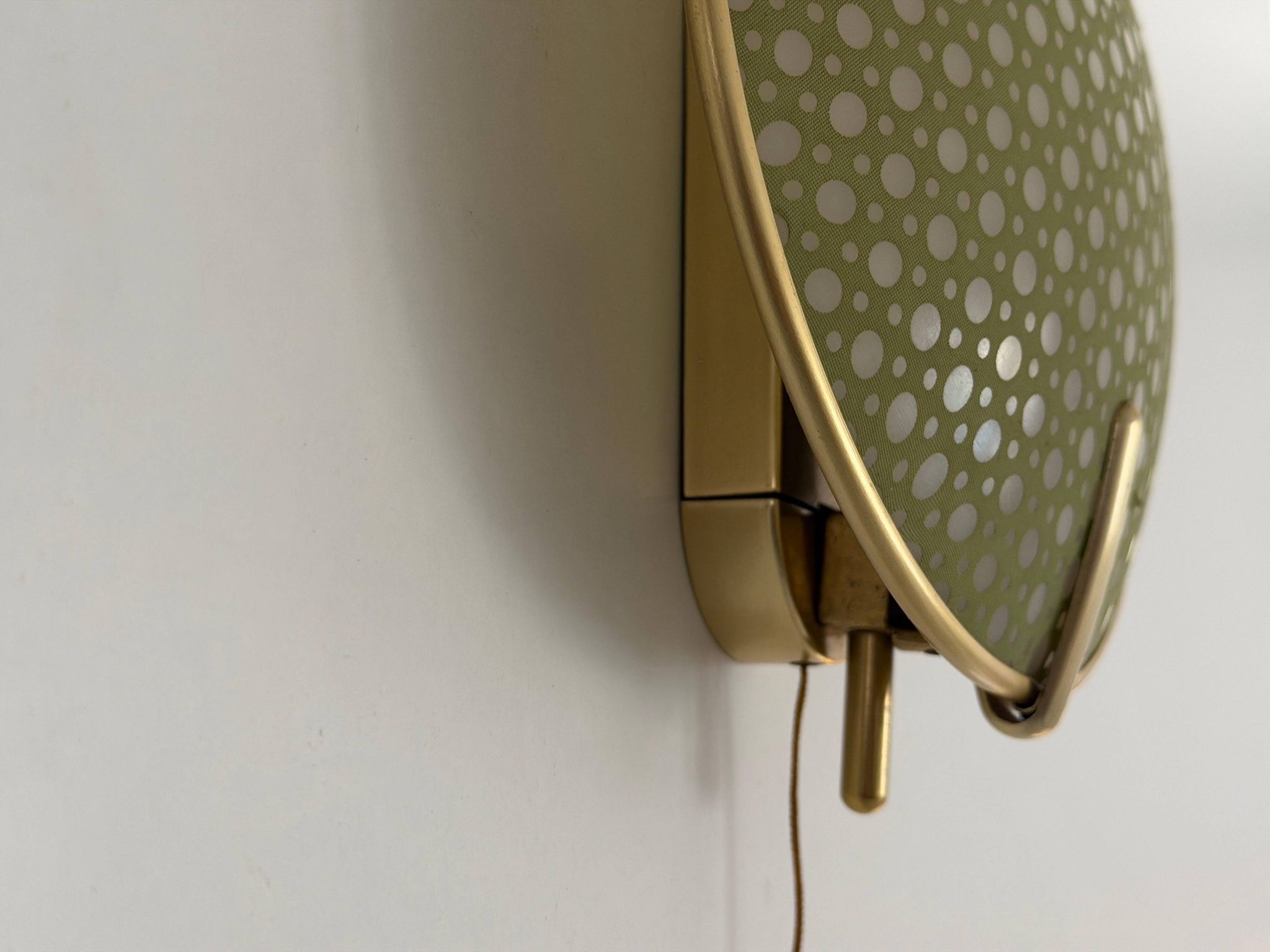 Pair of green plexiglass and gold metal wall lights by Erco, 1950s, Germany.