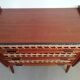Teak and rattan chest of drawers feet compass