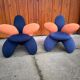 Pair of Lily chairs from the 1990s in blue and coral velvet, postmodern sculptural silhouette.