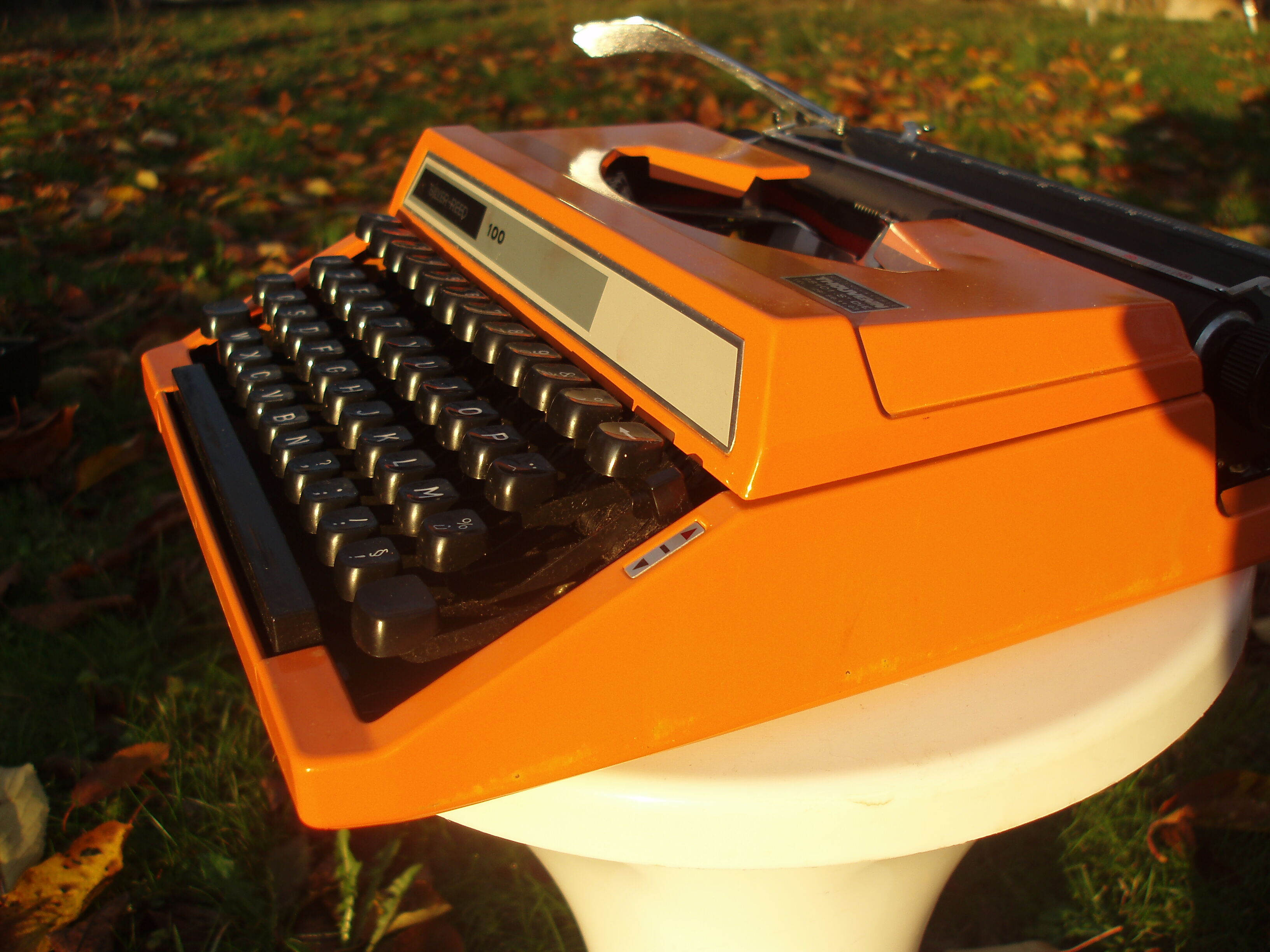 Silver reed orange and black typewriter with bag