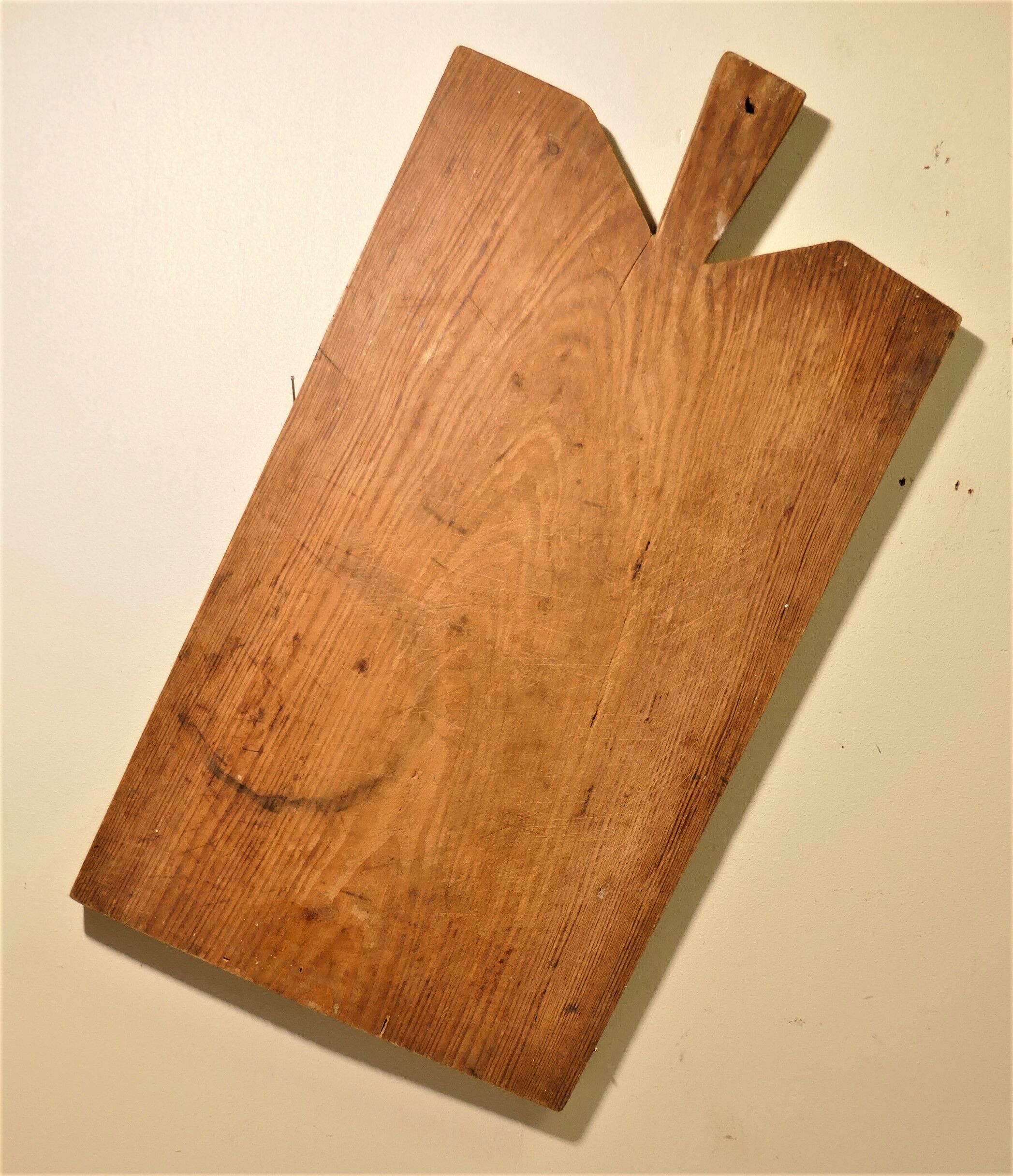 Cutting board in old raw wood