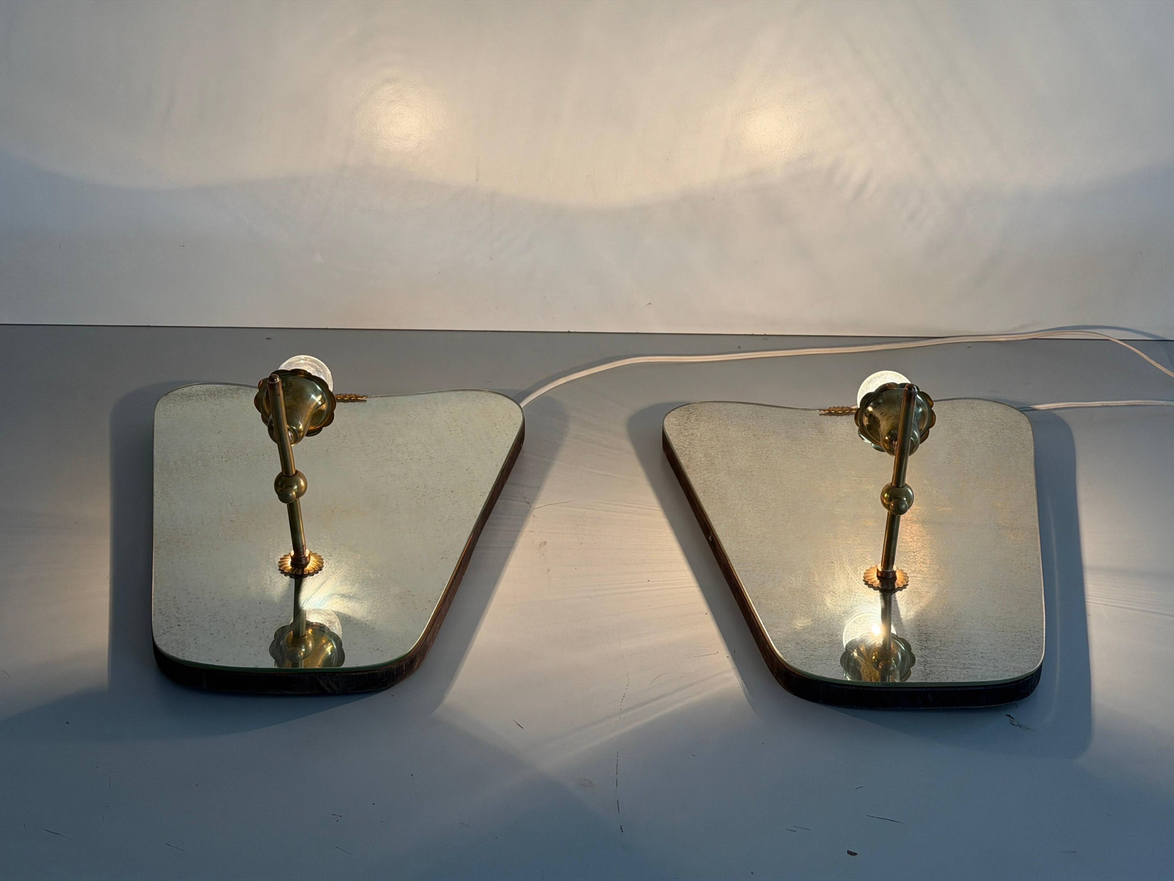 Pair of brass wall lights with mirrors, mid-20th century, Italy, 1960.