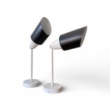 Pair of adjustable industrial metal wall sconces.