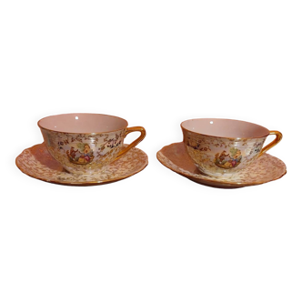 Set of two porcelain cups and plates