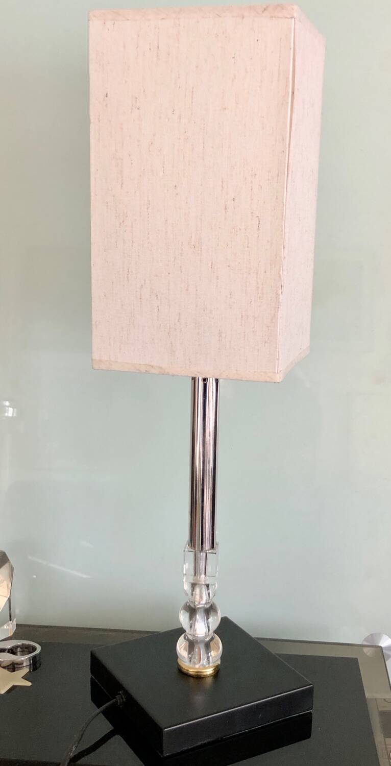 Silver floor lamp with a straight shade.