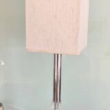 Silver floor lamp with a straight shade.