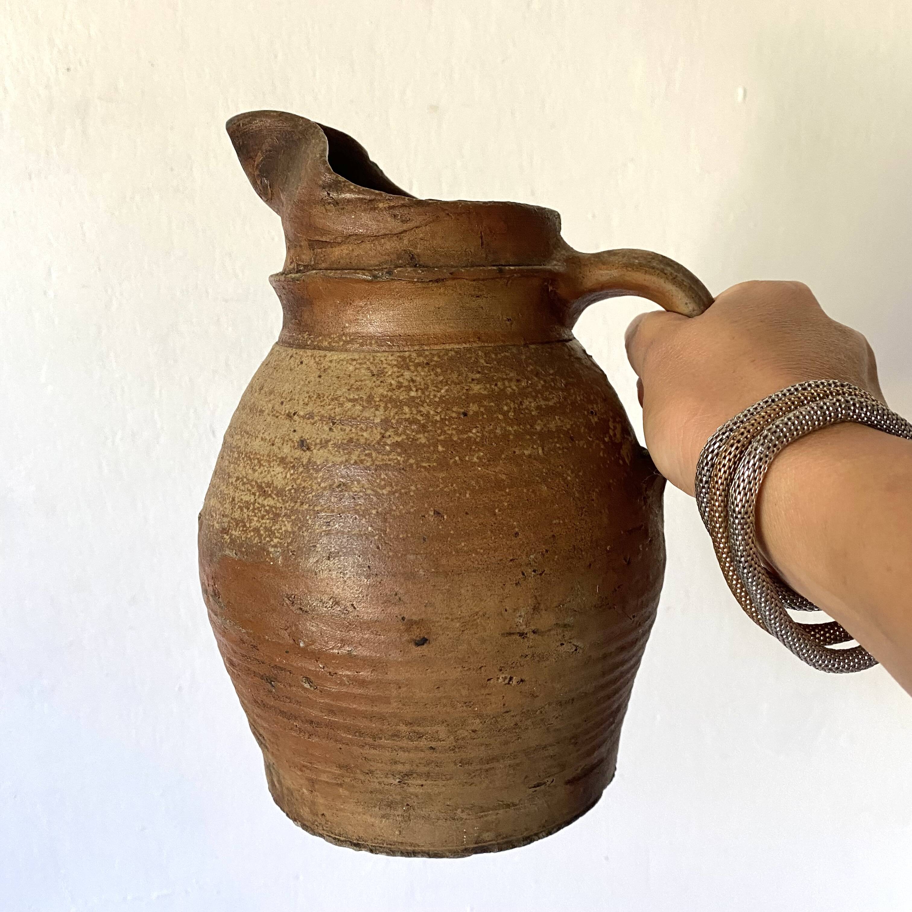 Antique terracotta pitcher