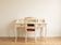 Retro secretary desk set and its beige wooden chair.