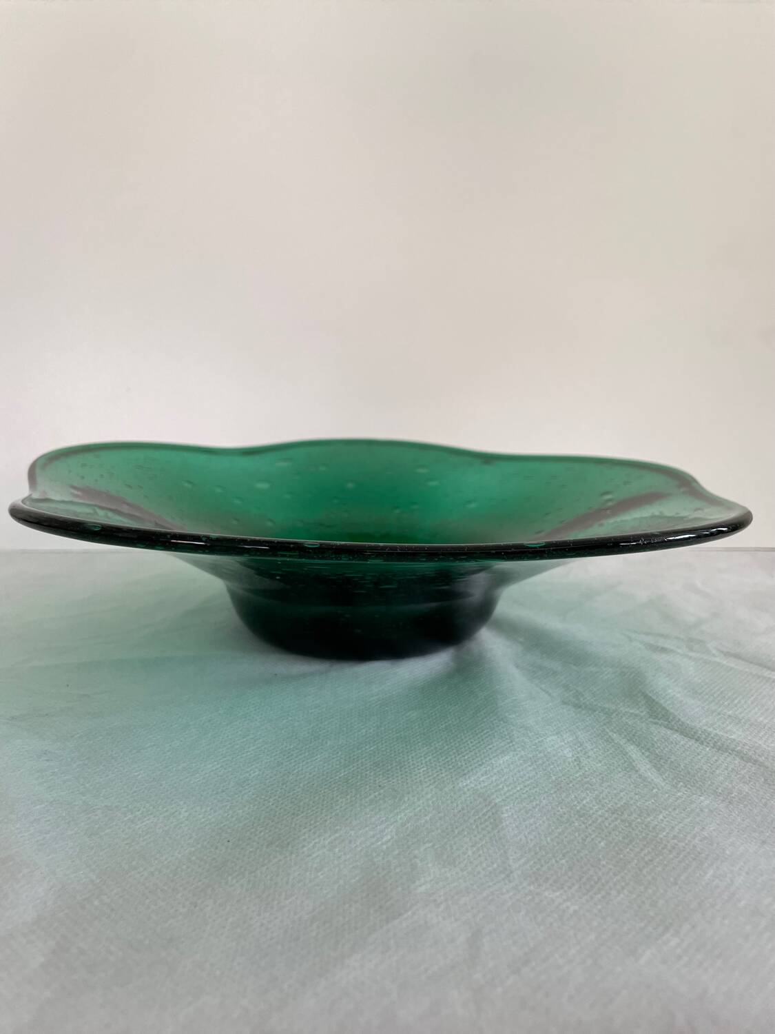 Green glass dish by Max Verboeket
