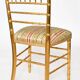 Pair of golden wood chairs in a bamboo style.