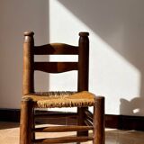 Low fireplace chair attributed to Charles Dudouyt.