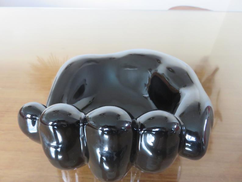 "hand" in black ceramic trinket bowl 60/70