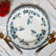 Old mismatched iron earthenware dessert plates accompanied by a dish