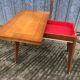 Table vintage portefeuille en chêne aux pieds compas.