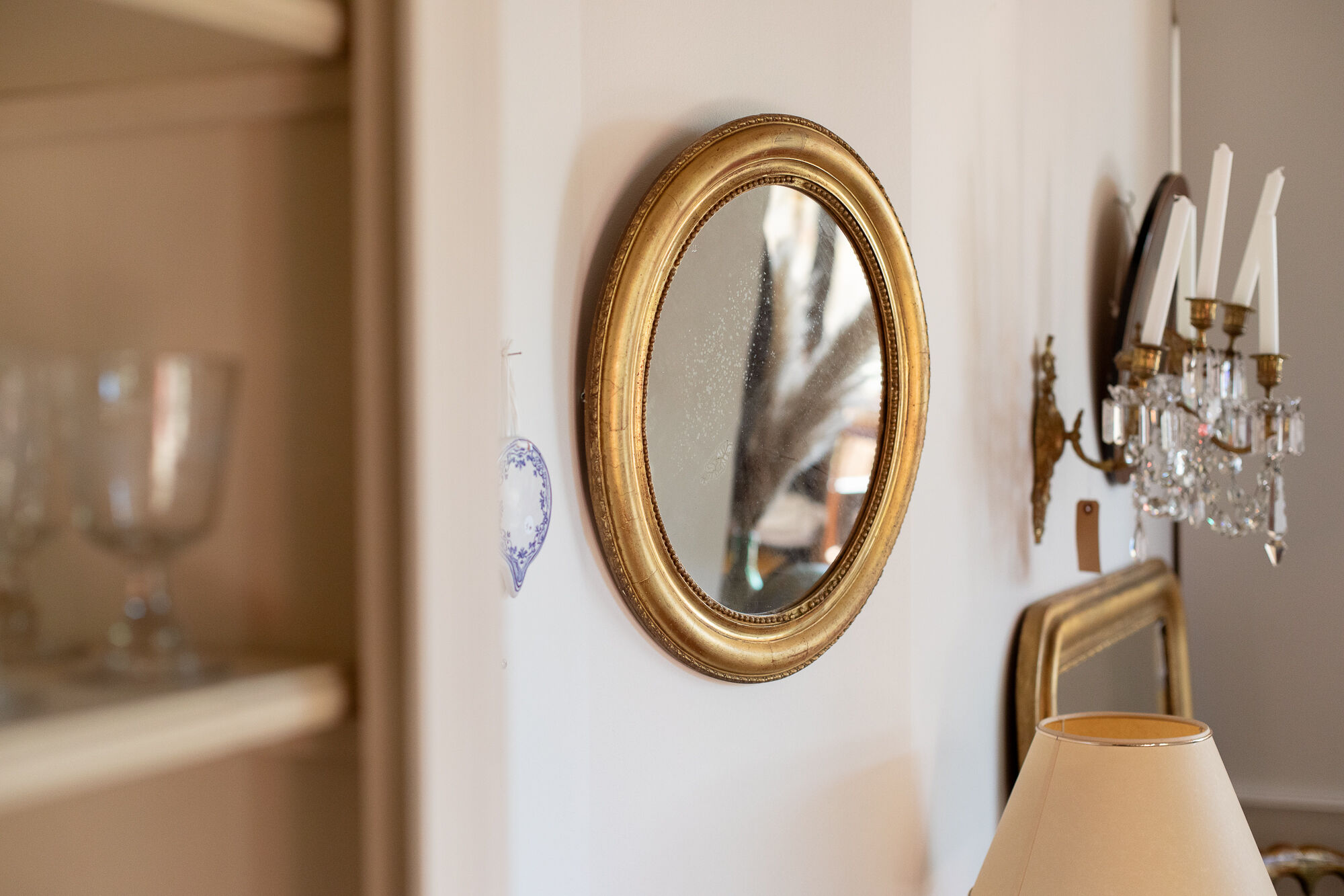Oval mirror in gilded wood late 19th