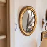 Oval mirror in gilded wood late 19th