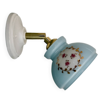 Vintage wall sconce with blue opaline glass shade and floral decorations